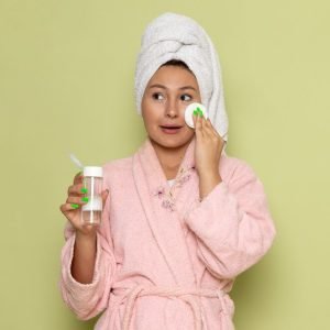 female-pink-bathrobe-cleaning-up-all-make-up-from-her-face_140725-25554.jpg